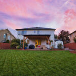 A house with a lawn in the middle of it